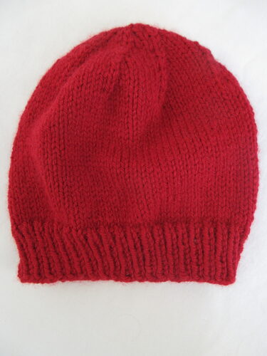 %%Handknit Adult Hat%%, Made and donated by Anne Morris, Peterborough, NH; Size small; Chunky washable wool blend; Red.