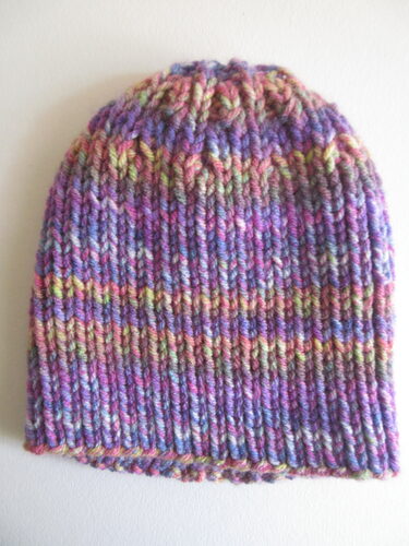 %%Handknit Adult Hat%%, Made and donated by Anne Morris, Peterborough, NH; Size small; Chunky washable wool blend; Pink, magenta and cream stripes.