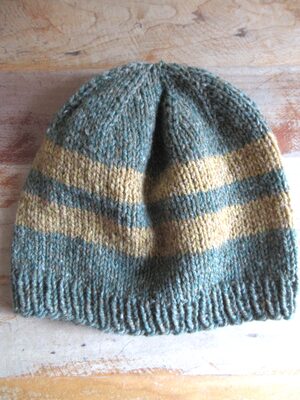 %%Hand Knitted Hat (4)%%, Made and donated by Ellen Orkins; Adult; 100% Wool; Green and gold.