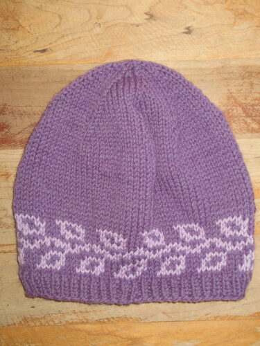 %%Hand Knitted Hat (5)%%, Made and donated by Ellen Orkins; Adult; 100% Soft Wool; Purple with vine patterns.