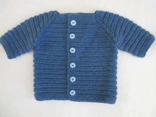 %%Handknit Infant Sweater%%, Made and donated by Anne Morris; Approximate size 6-9 months; Washable DK weight yarn; 75% acrylic and 25% wool; Blue with light blue buttons.