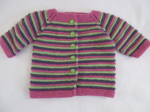 %%Handknit Infant Sweater%%, Made and donated by Anne Morris; Approximate size 6-9 months; Washable DK weight yarn; 75% acrylic and 25% wool; Pink, purple and green stripes with green buttons.