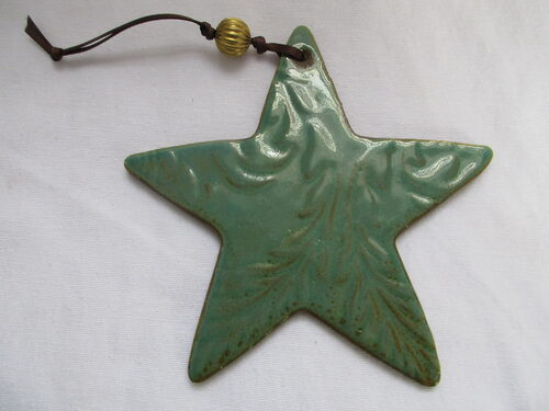 %%Star Ornament%%, Donated by Brick House Tile Co., Keene, NH; Located in a brick house built in 1860, Brick House Tile Co. has seven showrooms of ceramic, porcelain, and natural stone tile displayed in a farm house setting complete with a barn where the manufacturing of Cider Press Tile takes place. The staff at Brick House is trained to assist in both the designing of your dream project and the installation processes involved, ensuring that you are satisfied with your tile for years to come. https://www.brickhousetiles.com/