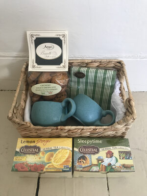 %%Tea Themed Basket%%, Donated by Mary Kate Long and Karen Coteleso; Contains: 2 Bennington Potter Stoneware Pottery tea cups, tea towel, decorative napkins, teas and cookies.