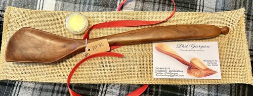 %%Hand Carved Wooden Spoon%%, Made and donated by Phil Gargan; This sturdy cooking spoon is hand carved from local wood, in this case Apple. It comes with a tin of wood balm for caring and rejuvenating any wood frequently washed.