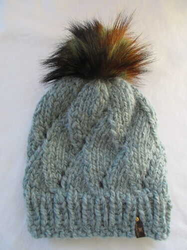 %%Handknit Adult Hat%%, Made and donated by Alyssa Nykanen; Removeable pompom; 80% acrylic and 20% alpaca yarn; Gray/blue color; Nice and thick and warm!