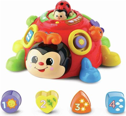 %%Vtech Crazy Legs Learning Bug%%, Donated by the Barry family; New in box; For ages 12 mos.+; Multi-feature baby toy that create a visual and educational experience for your child; Features a flapping butterfly and sliding caterpillar to create multiple playing experiences and actions, such as pull, slide or pop; Includes shape buttons, counting, objects in nature, and music; Includes 2 sing-along songs and 15 melodies; Offers sensory play while enjoying hours of fun.